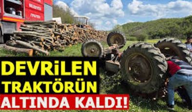 Tarla sürerken, 1.50 metre yükseklikten devrilen traktörün altında kaldı