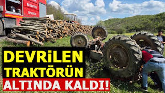 Tarla sürerken, 1.50 metre yükseklikten devrilen traktörün altında kaldı
