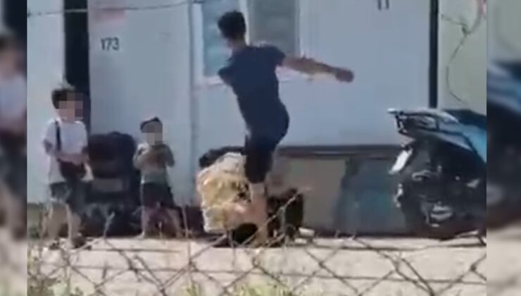 Karısını yere yatırıp çocuklarının gözü önünde tekme tokat dövdü